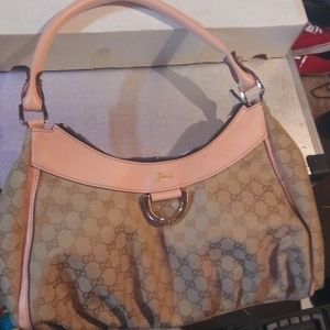 Gucci purse classic color with pink trim